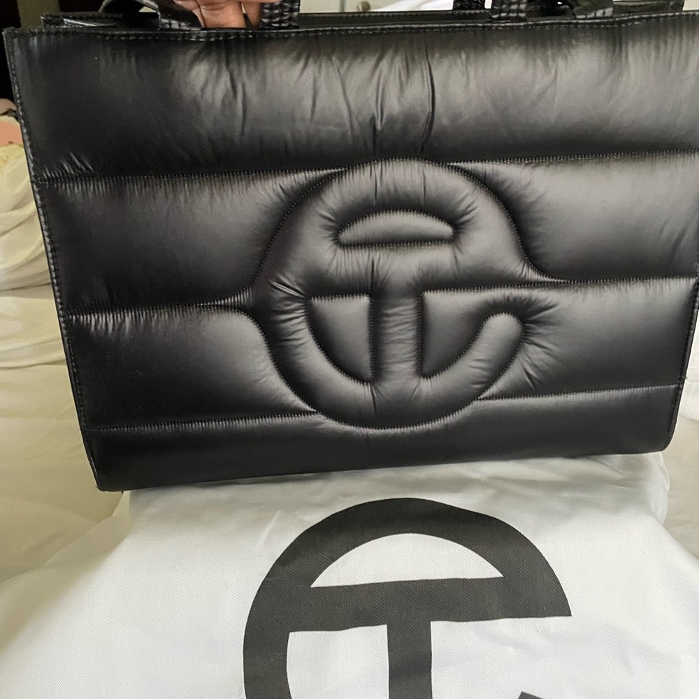 Extremely gently used puffer medium Telfar. I like it but I never wear it.